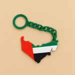 Load image into Gallery viewer, ميدالية خريطة الإمارات بسلسلة خضراء ليوم العلم - صورة تفاصيل المنتج على خلفية بيج